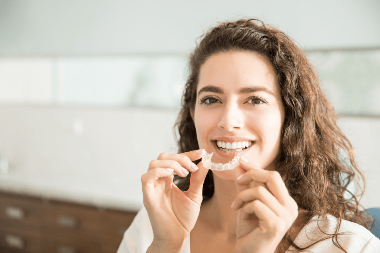 Patient holding a clear aligner