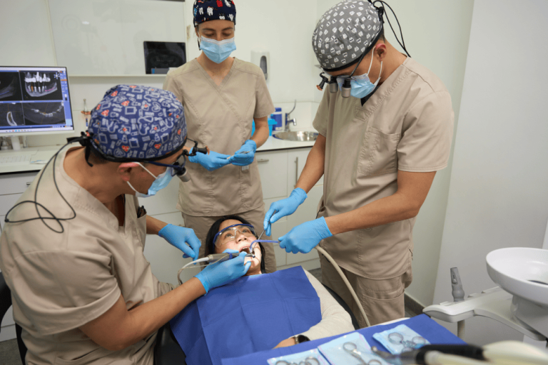 Surgical team performing a wisdom tooth extraction